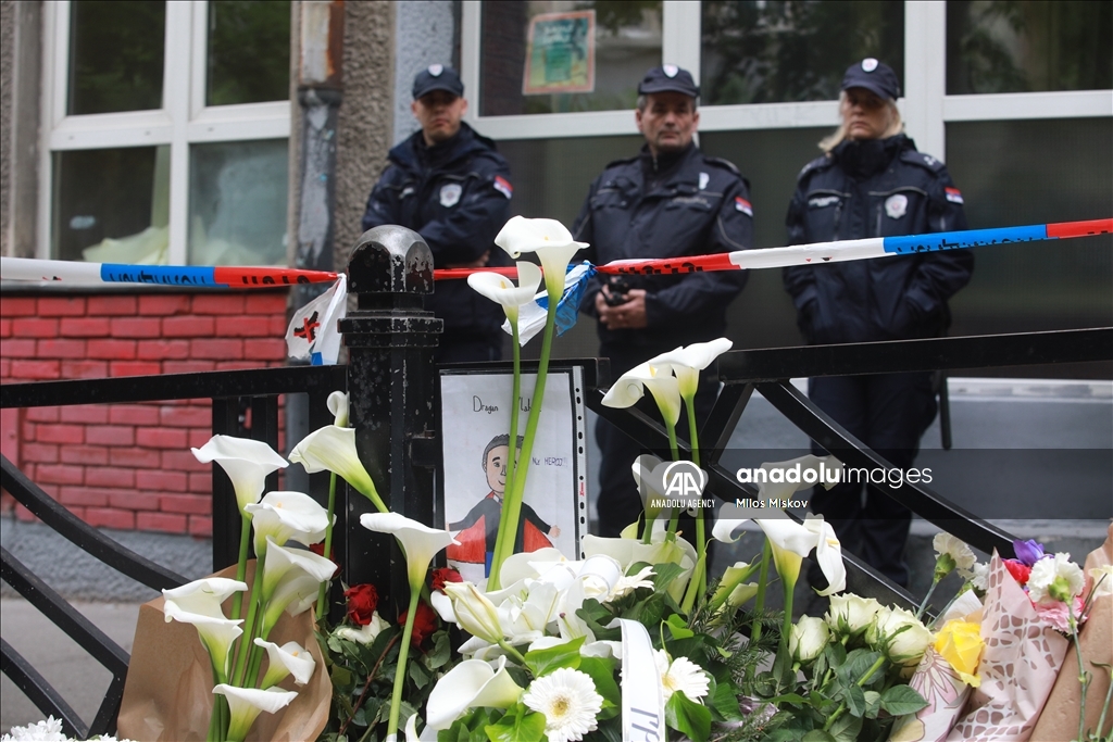 Thousands gather to pay tribute to victims of school shooting in Serbia