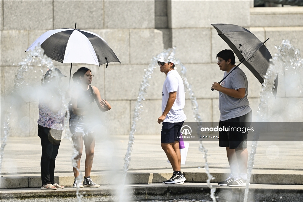 More than half of US under heat, flood advisories