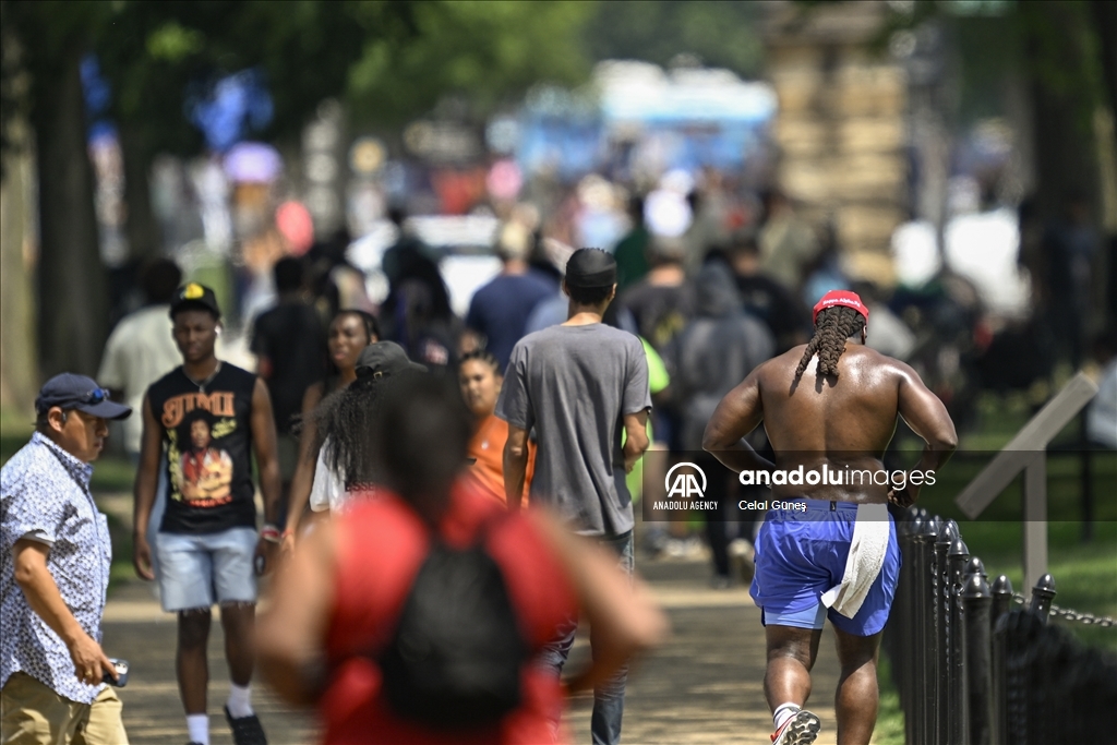 More than half of US under heat, flood advisories