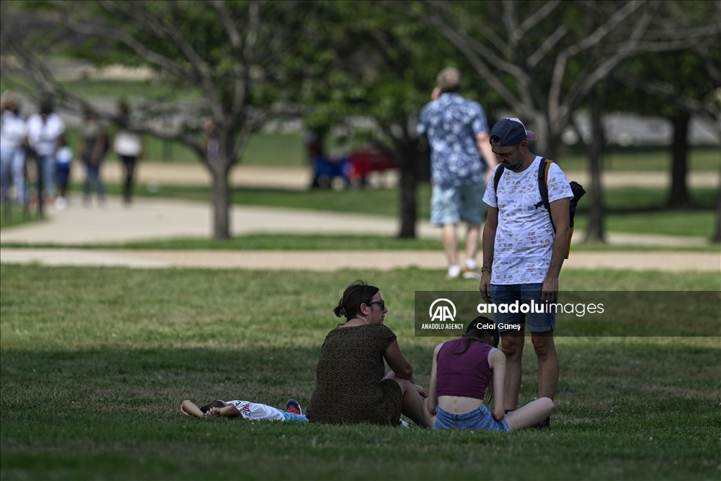 More than half of US under heat, flood advisories