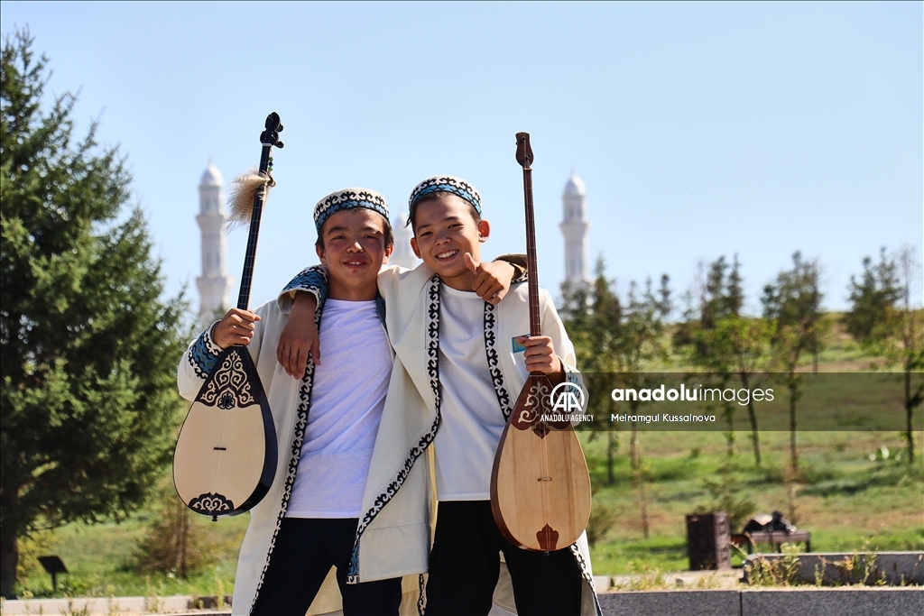 Kazakh singer and music teacher Ibragim Eskendir gives dombra lessons in Astana