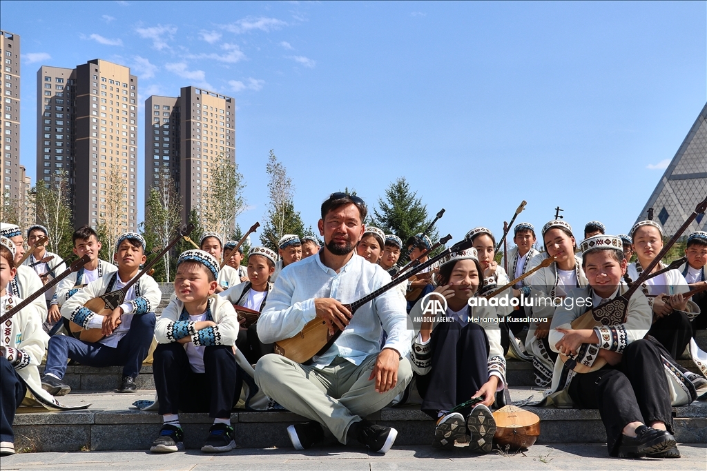 Kazakh singer and music teacher Ibragim Eskendir gives dombra lessons in Astana