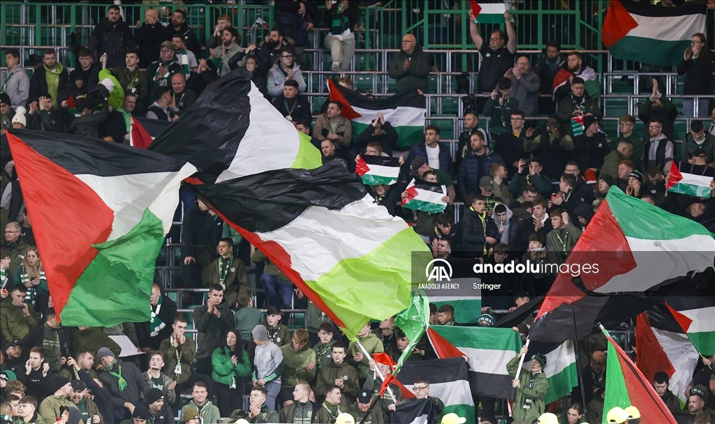 Supporters hold Palestinian flags during Celtic FC v Atletico Madrid 