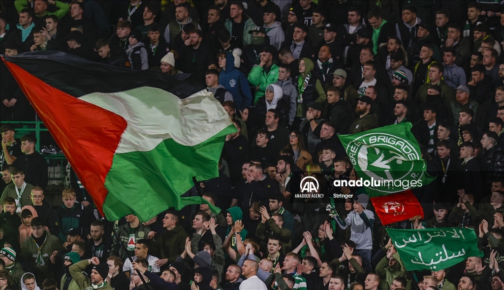 Supporters hold Palestinian flags during Celtic FC v Atletico Madrid 