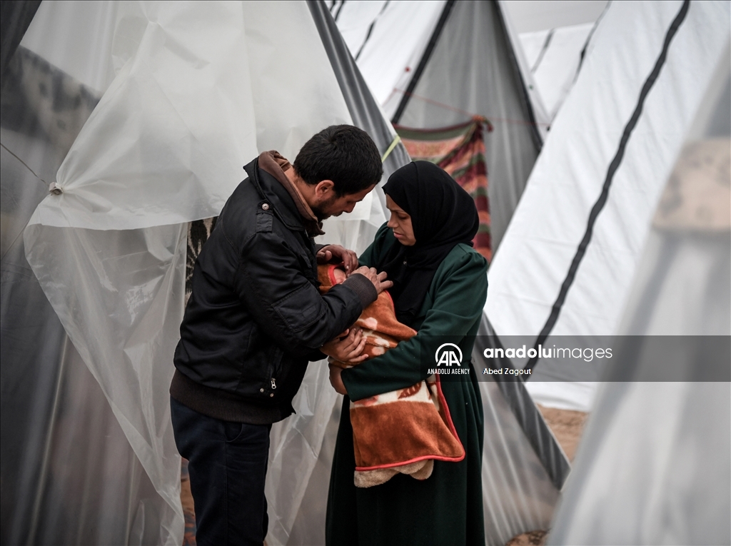 Gazan mother with her baby lives in a tent under difficult conditions in Rafah