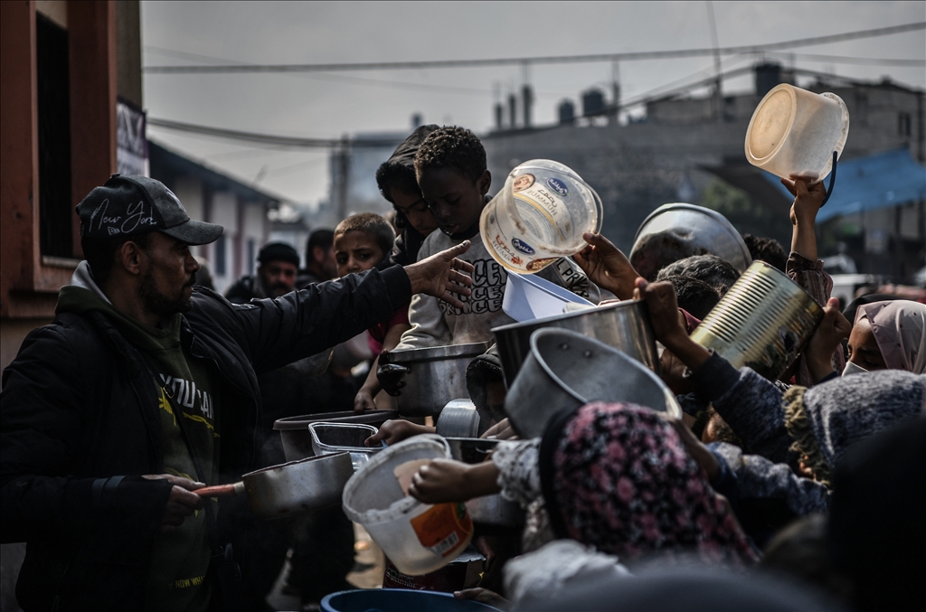 Palestinians wait long queues for food in Rafah