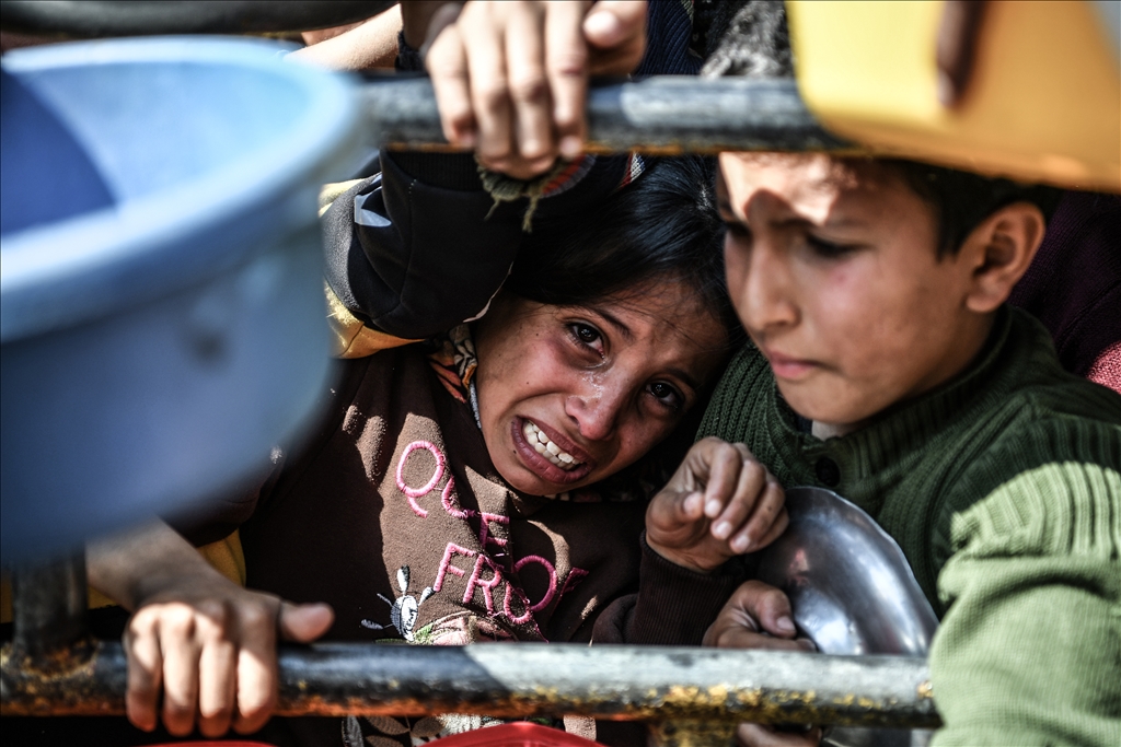 Palestinians wait long queues for food in Rafah