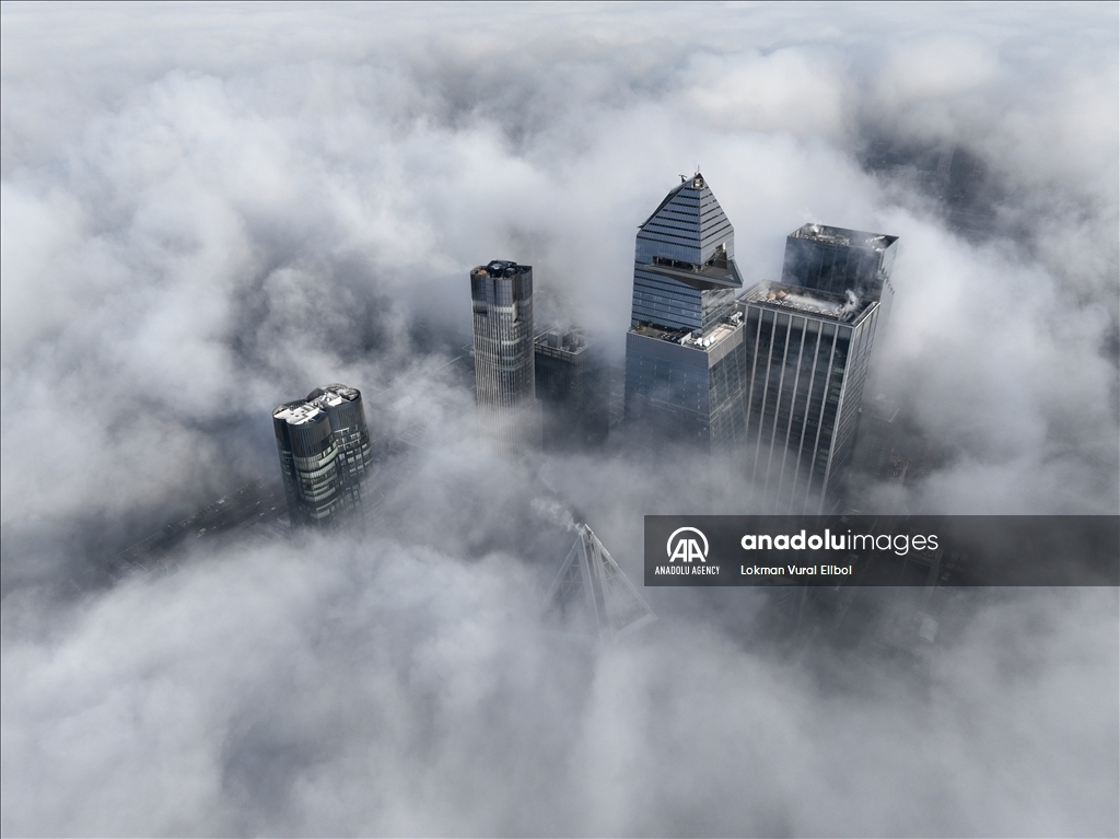 New York City skyline under rolling fog