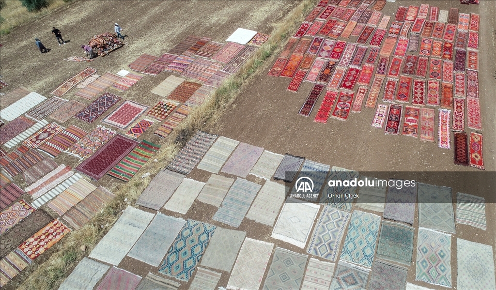 Authentic Turkish rugs laid under Antalya sun