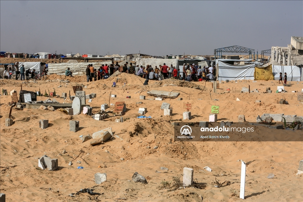 Gazan families fleeing Israeli attacks live in a cemetery
