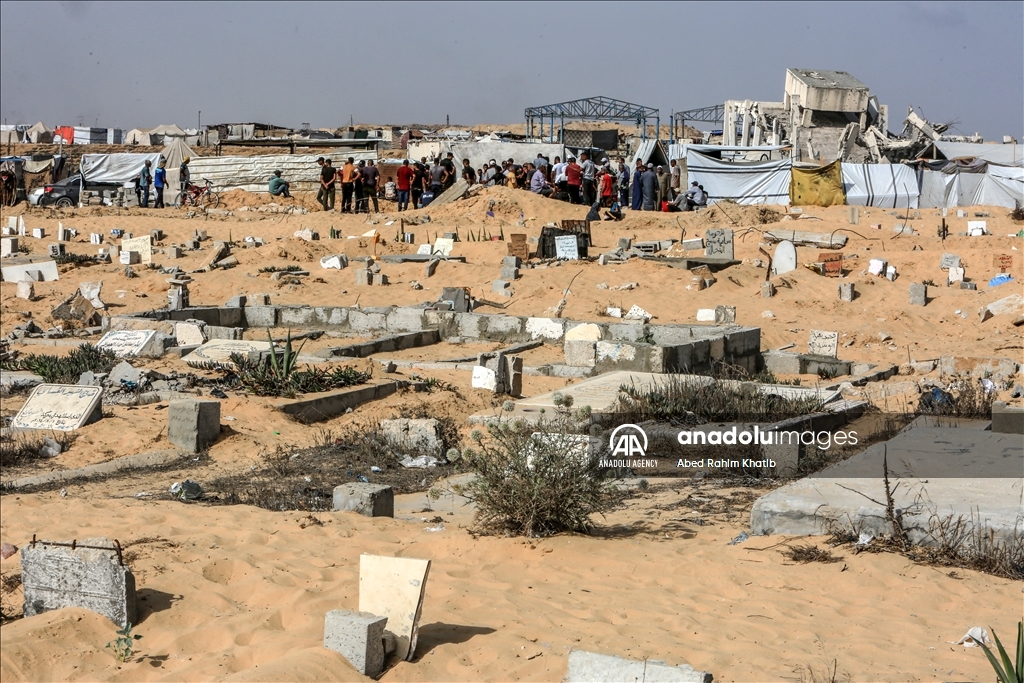 Gazan families fleeing Israeli attacks live in a cemetery