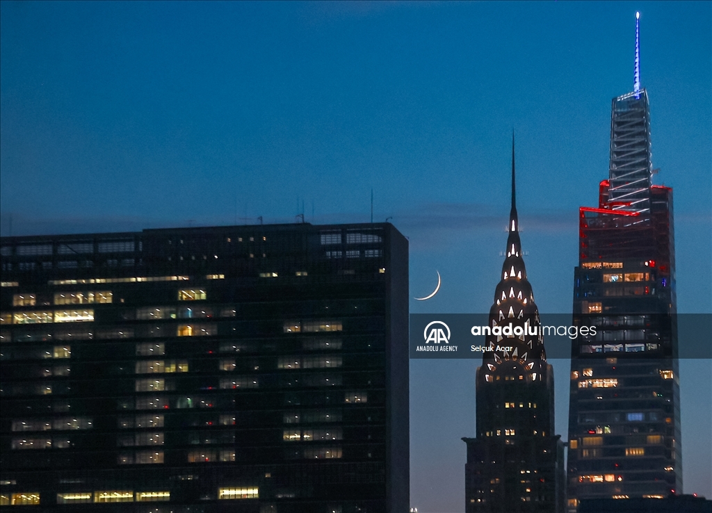 Crescent moon rises over New York City skyline