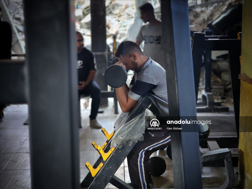 Palestinians try to continue training in damaged gym in Khan Yunis