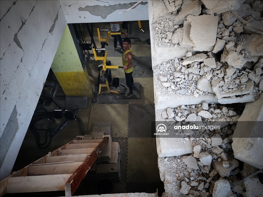 Palestinians try to continue training in damaged gym in Khan Yunis