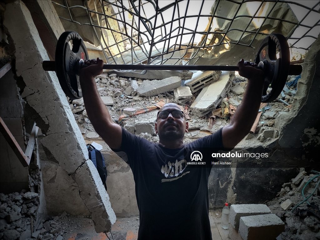 Palestinians try to continue training in damaged gym in Khan Yunis