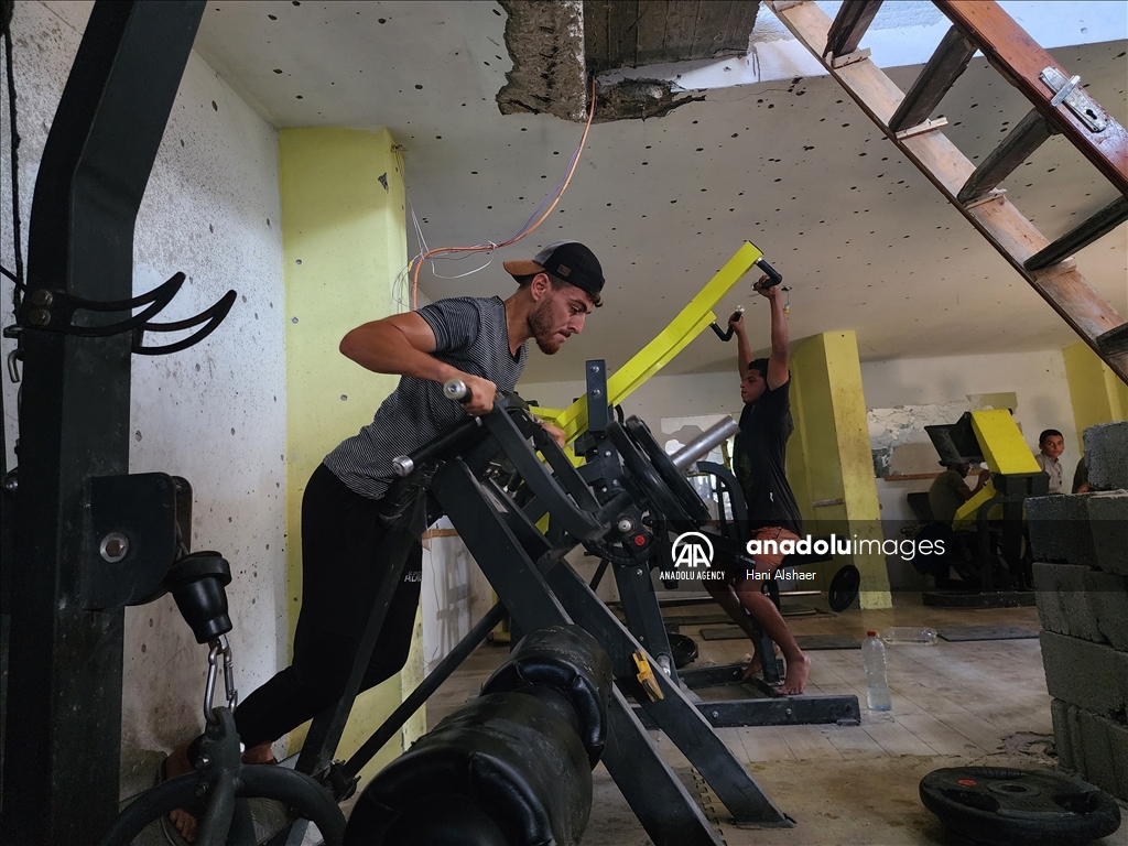 Palestinians try to continue training in damaged gym in Khan Yunis