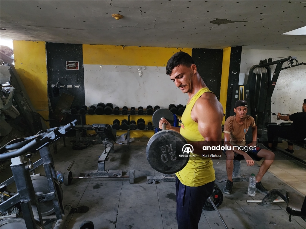 Palestinians try to continue training in damaged gym in Khan Yunis