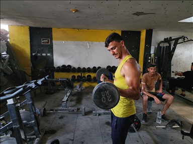 Palestinians try to continue training in damaged gym in Khan Yunis