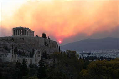 Smoke rises over Parthenon temple during a wildfire in Athens