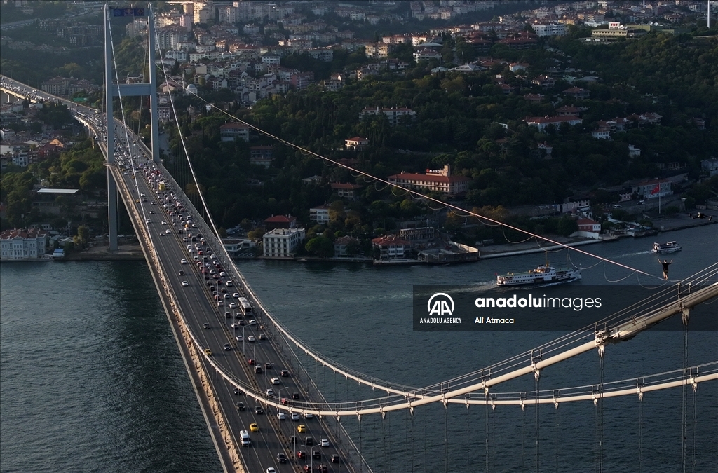 Red Bull athlete Jaan Roose walks tightrope from Asia to Europe over bridge in Turkiye's Istanbul