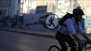 Israeli West Bank barrier adorned with pro-Palestinian graffiti