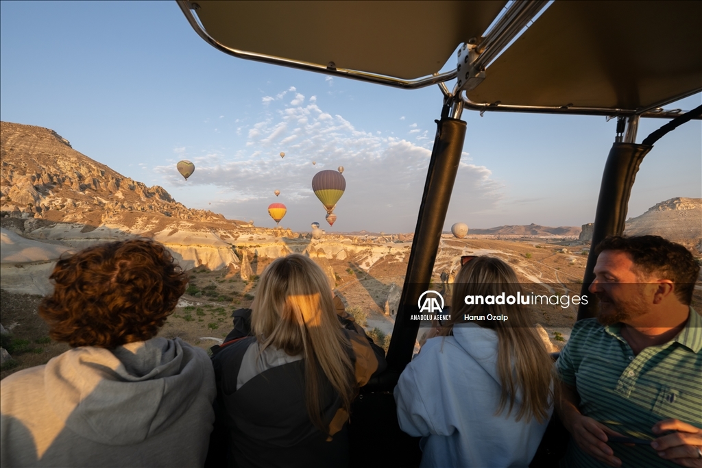 Hot air balloons fly over Cappadocia
