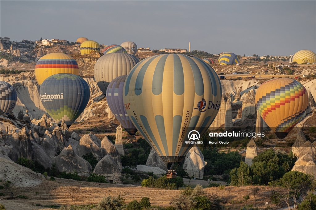 Hot air balloons fly over Cappadocia