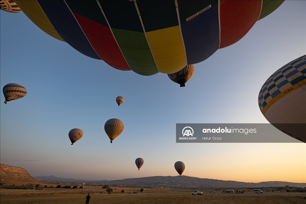 Hot air balloons fly over Cappadocia