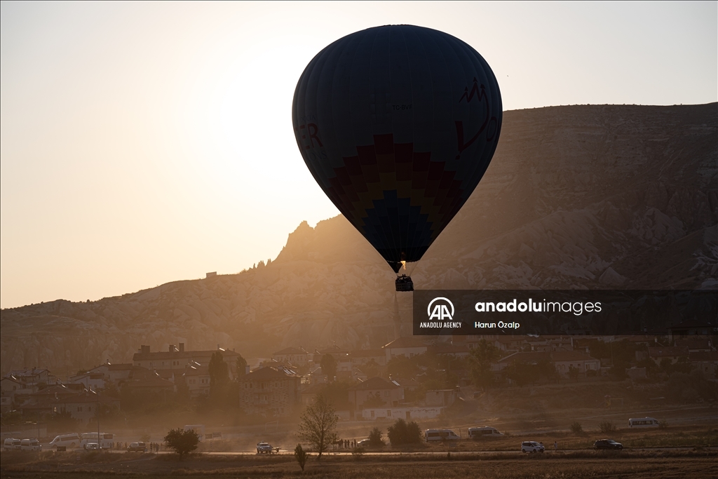 Hot air balloons fly over Cappadocia