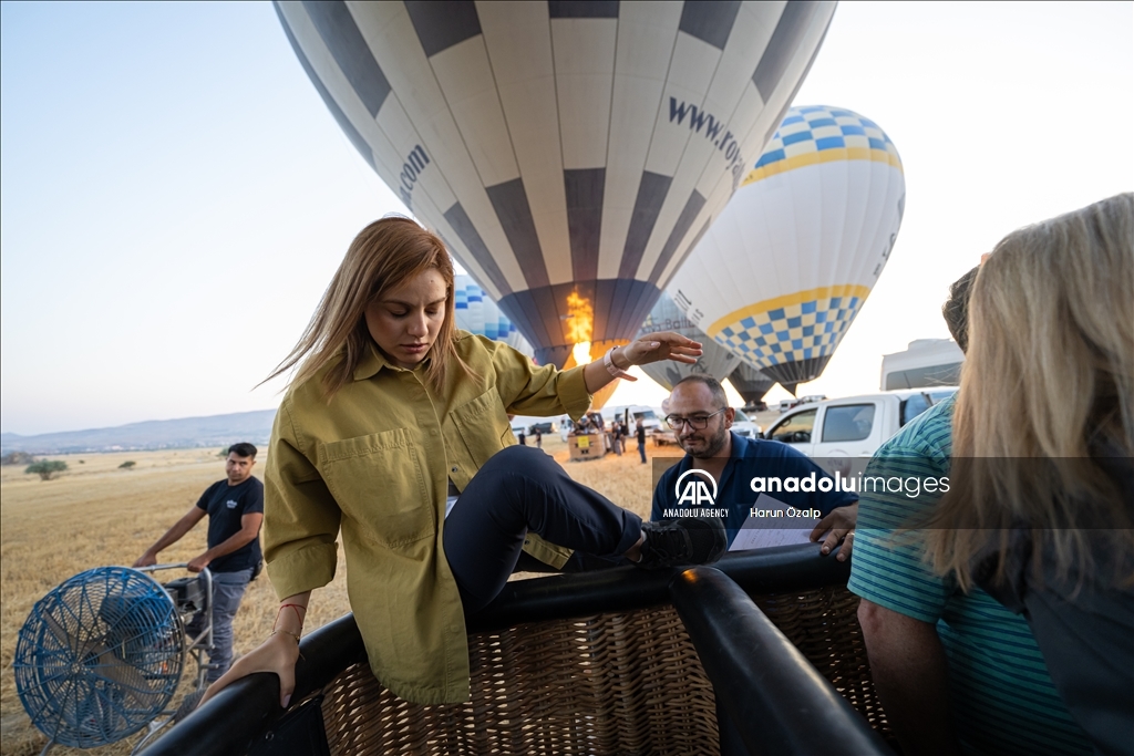 Hot air balloons fly over Cappadocia