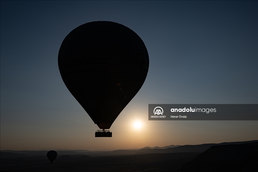 Hot air balloons fly over Cappadocia