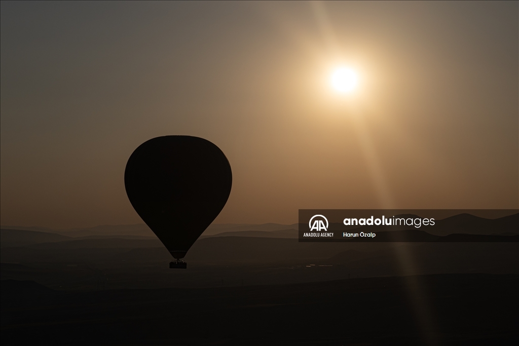 Hot air balloons fly over Cappadocia