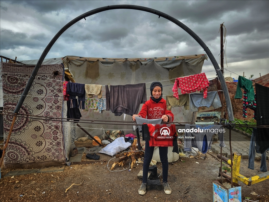 Palestinians living in tents due to Israeli attacks struggle with the cold weather