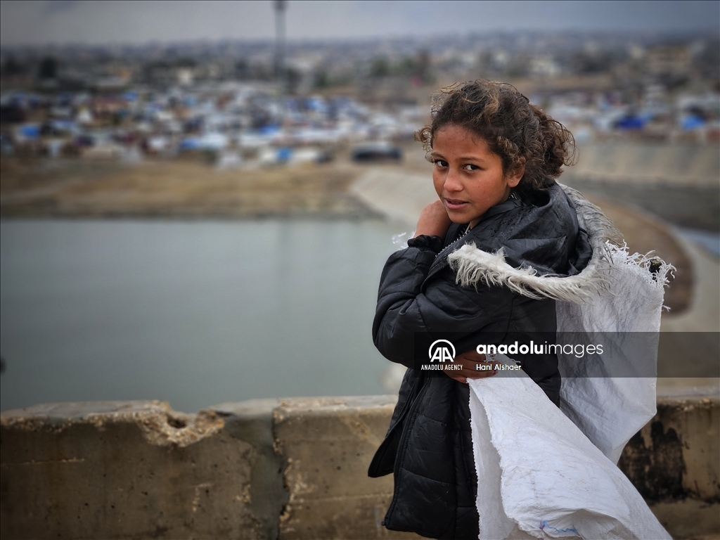 Palestinians living in tents due to Israeli attacks struggle with the cold weather