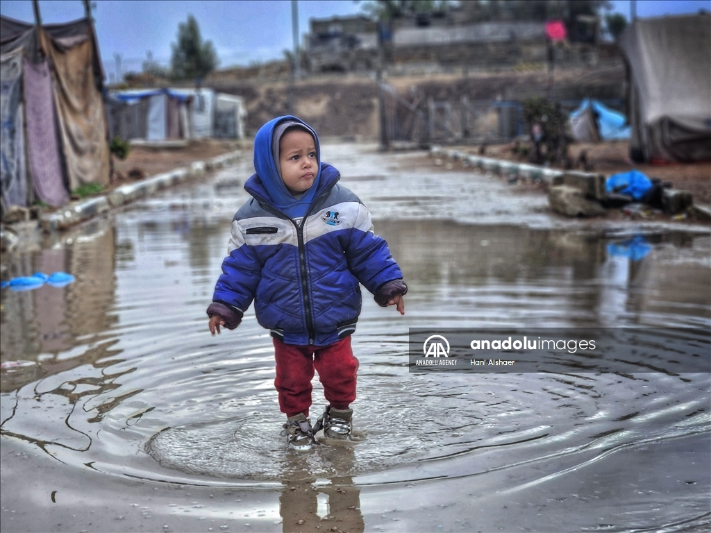 Palestinians living in tents due to Israeli attacks struggle with the cold weather