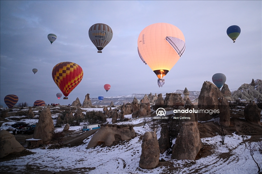 Hot air balloons with "Palestinian keffiyeh" pattern rise above Cappadocia