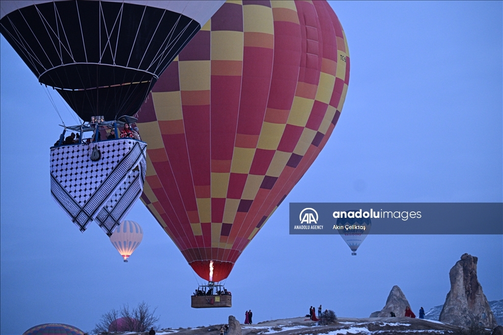 Hot air balloons with "Palestinian keffiyeh" pattern rise above Cappadocia