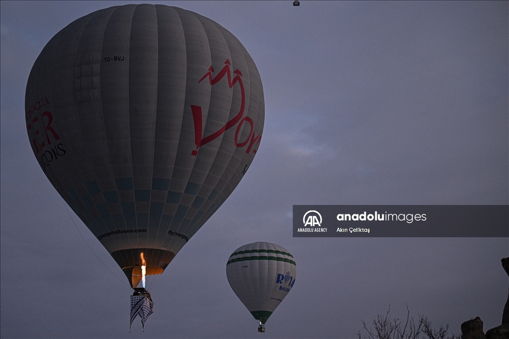 Hot air balloons with "Palestinian keffiyeh" pattern rise above Cappadocia