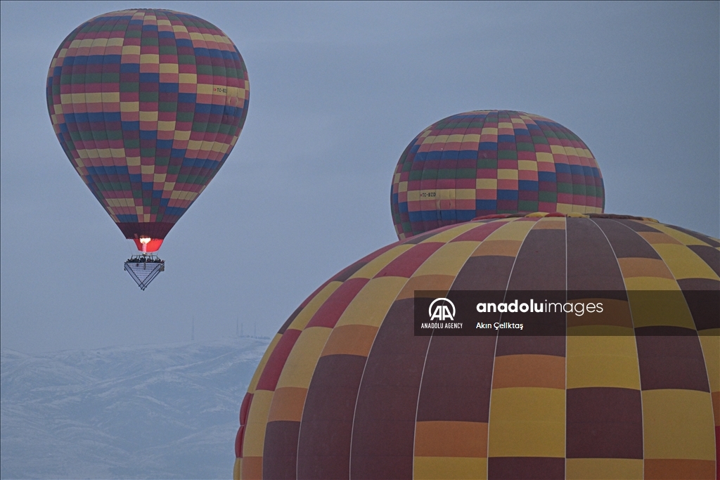 Hot air balloons with "Palestinian keffiyeh" pattern rise above Cappadocia