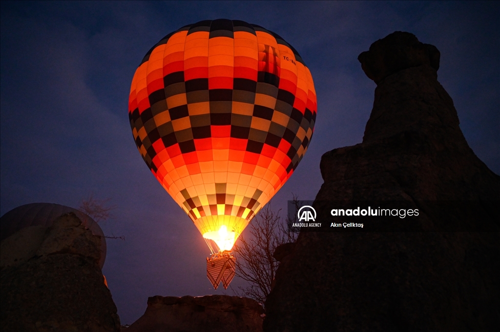 Hot air balloons with "Palestinian keffiyeh" pattern rise above Cappadocia