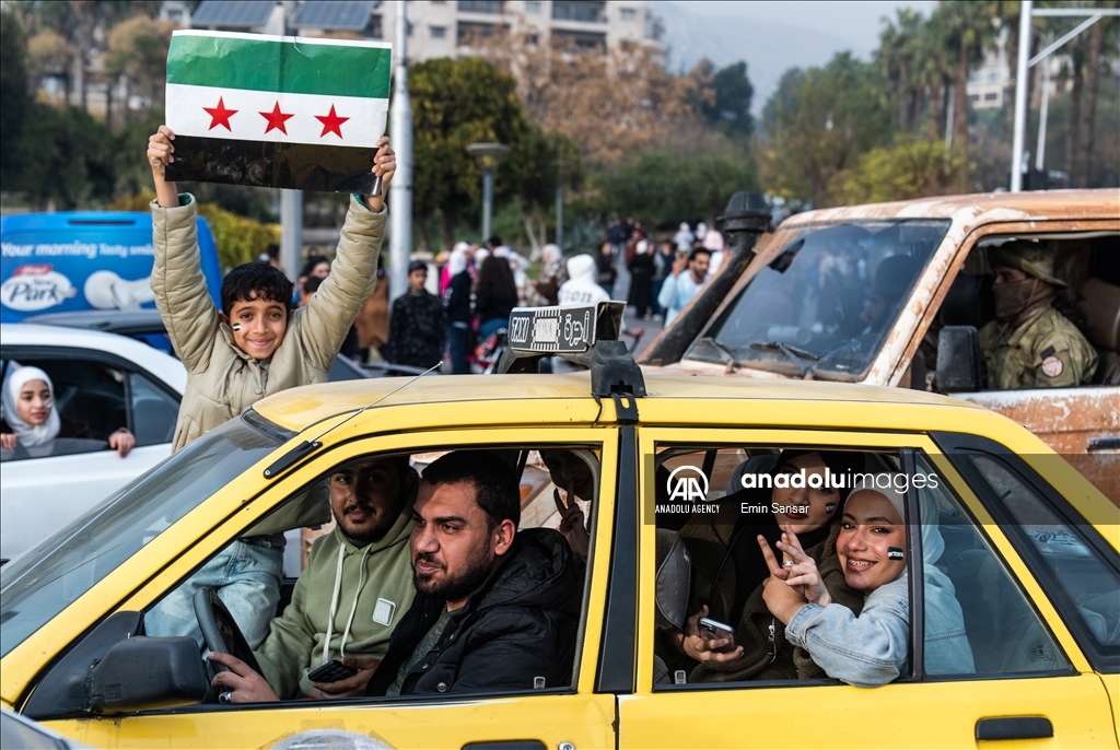 Syrians in Damascus celebrate the collapse of 61-Year Baath Regime