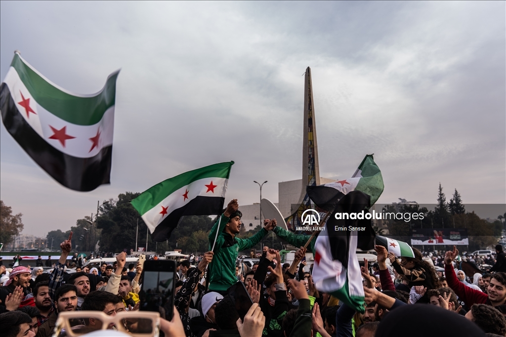 Syrians in Damascus celebrate the collapse of 61-Year Baath Regime