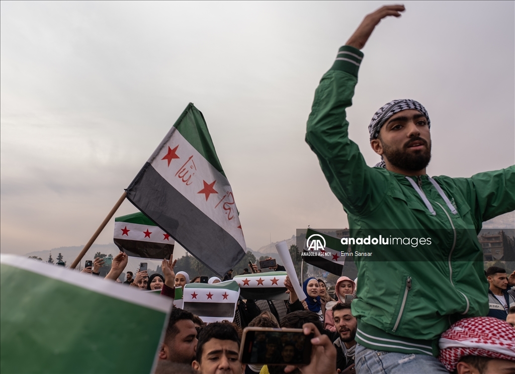Syrians in Damascus celebrate the collapse of 61-Year Baath Regime