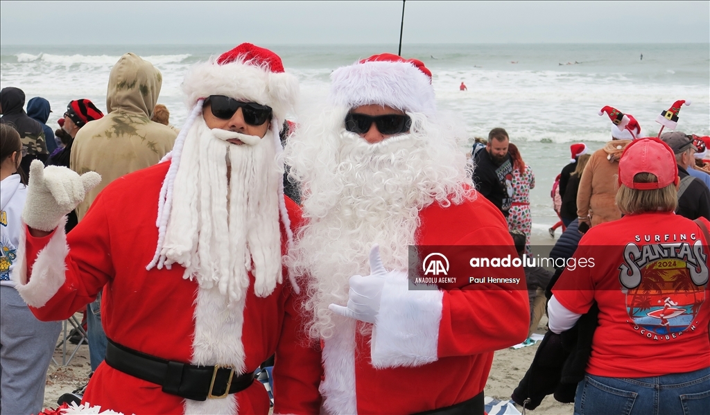 Surfing Santas Hit the Waves in Cocoa Beach, Florida