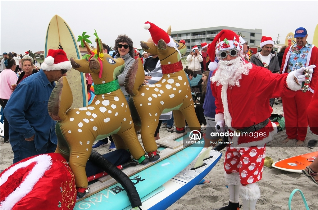 Surfing Santas Hit the Waves in Cocoa Beach, Florida