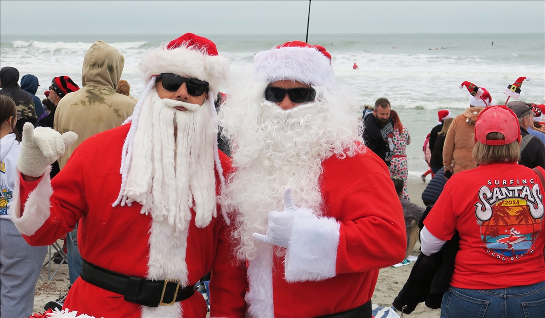 Surfing Santas Hit the Waves in Cocoa Beach, Florida