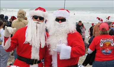 Surfing Santas Hit the Waves in Cocoa Beach, Florida