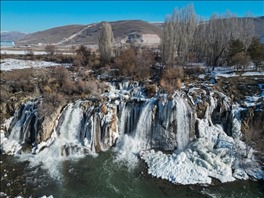 Partially frozen Muradiye Waterfall in Turkiye's Van