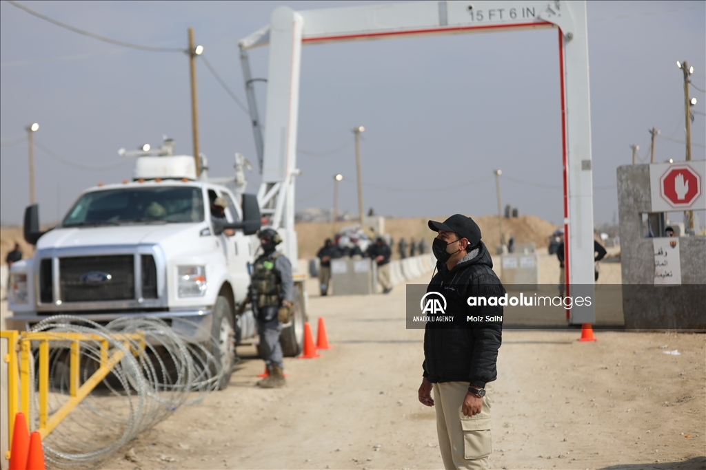 Palestinians undergo security checks as they return home after ceasefire agreement