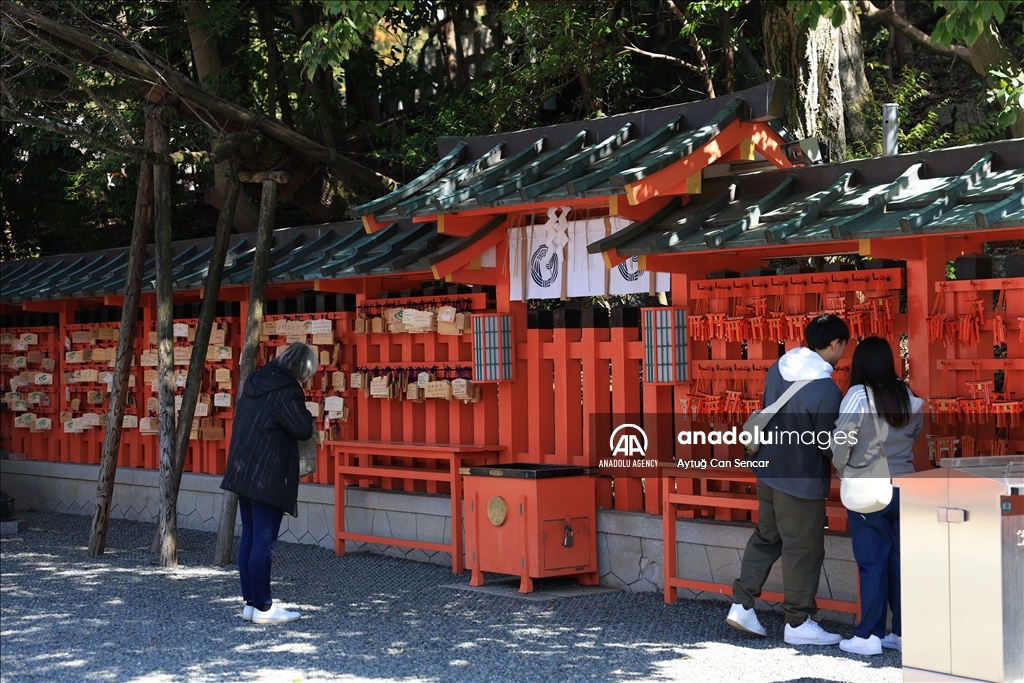 Fushimi Inari Shrine in Kyoto welcomes tourists and locals, reflecting daily life
